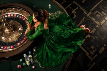 A cheerful woman in traditional clothing using her smartphone during a festive moment, showing how easily the 678DB app fits into everyday life.