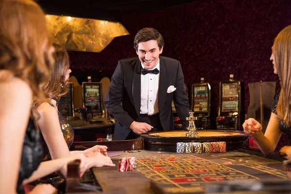 A stylish woman beside vibrant slot machines displaying glowing sevens, showcasing the variety of top slots at 678DB.