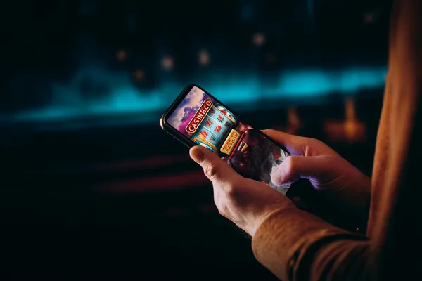 A close-up shot of golden coins falling around a spinning roulette wheel, representing immersive casino action at 678DB.